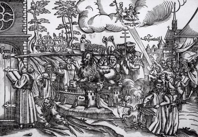 Martin Luther (1483-1546) schreibt 1517 an die Kirchentür in Wittenberg von German School
